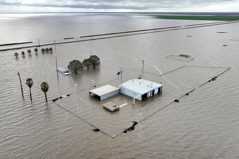 Corcoran, CA, Thursday, March 30, 2023 - The El Rico Pipe Yard on 10th Ave., remains submerged as the resurgent Tulare Lake continues to expand. (Robert Gauthier/Los Angeles Times)