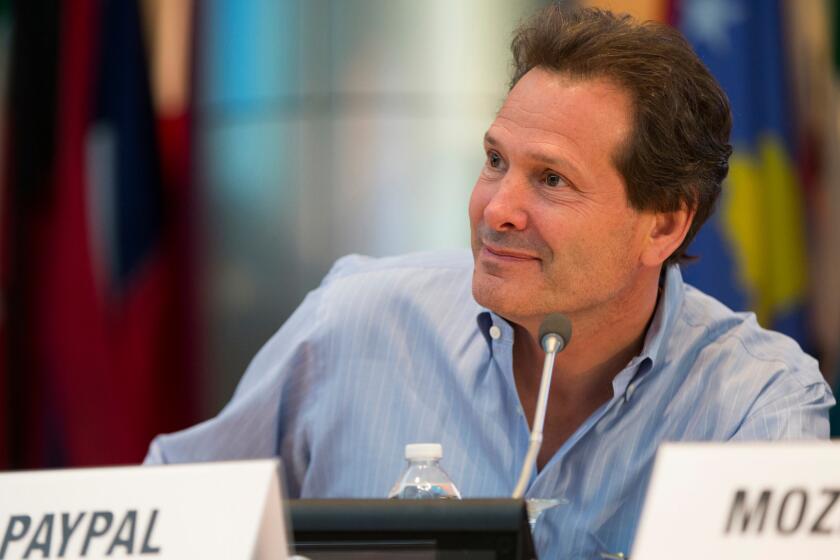 Paypal President and CEO Dan Schulman attends an event at the World Bank in Washington on April 14. Schulman said in a statement that PayPal is ending plans to hire 400 people for a new operations center in Charlotte, N.C.