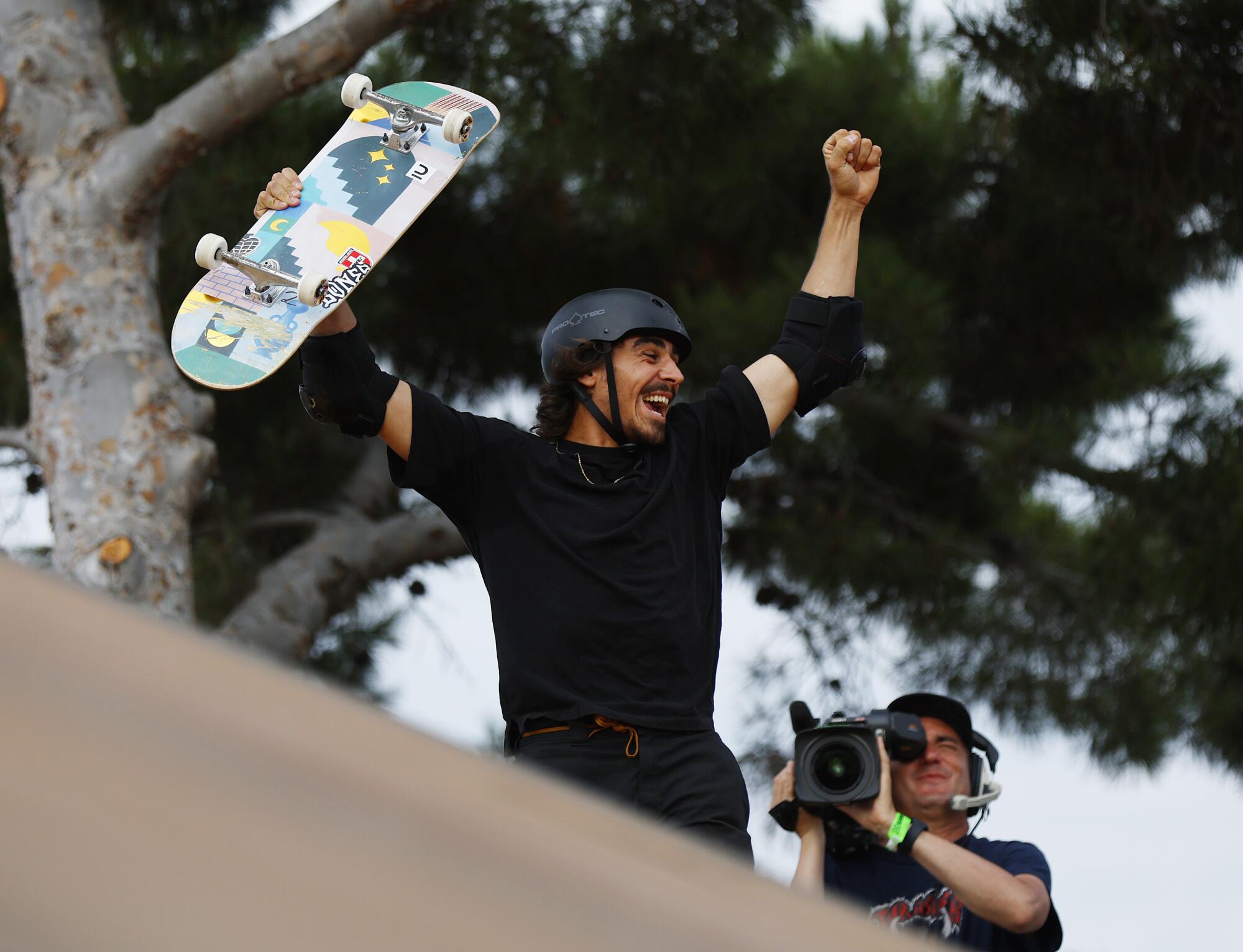 Edouard Damestoy of France celebrates after he won the skateboard megapark.