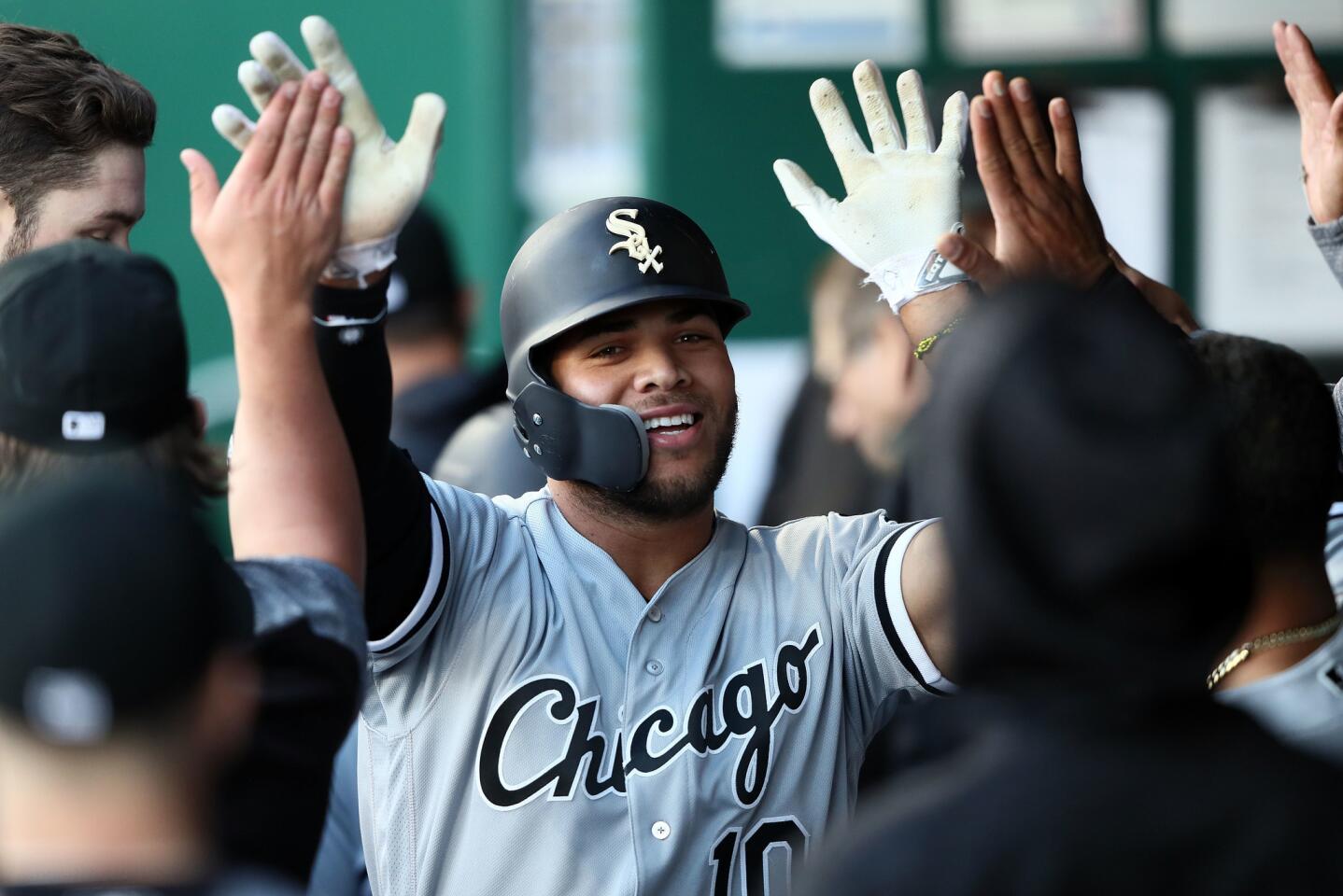 White Sox second baseman Yoan Moncada is congratulated by teammates in the dugout after hitting a home run during the first inning against the Royals at Kauffman Stadium on April 26, 2018 in Kansas City, Mo.