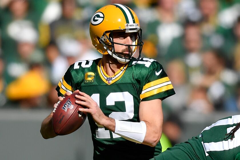 GREEN BAY, WISCONSIN - OCTOBER 20: Aaron Rodgers #12 of the Green Bay Packers looks to pass the football against the Oakland Raiders at Lambeau Field on October 20, 2019 in Green Bay, Wisconsin. (Photo by Quinn Harris/Getty Images)