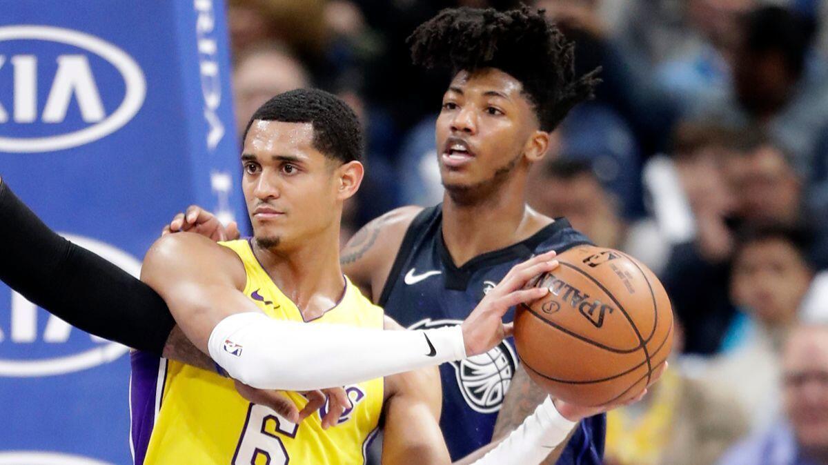 Lakers' Jordan Clarkson (6) looks to pass the ball as he is defended by Orlando Magic's Elfrid Payton during the second half on Wednesday.