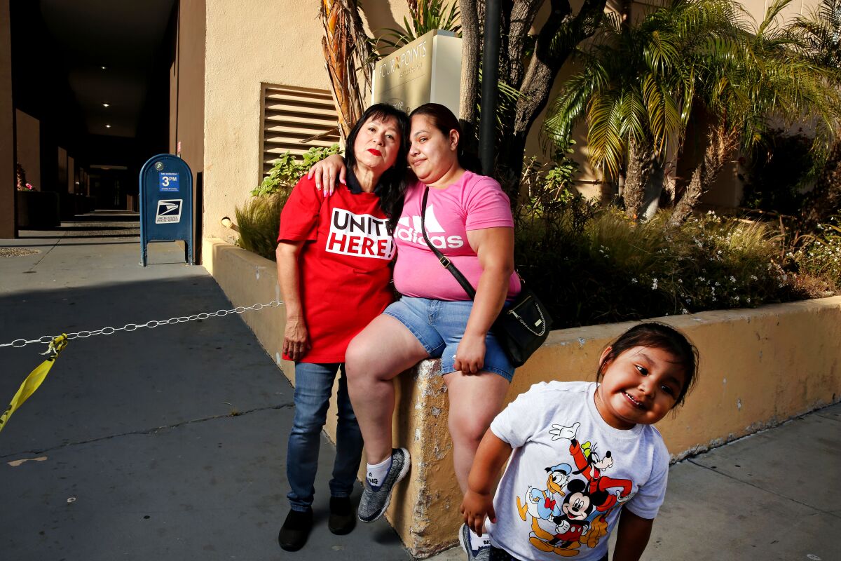 A Latina mother, daughter and grandmother