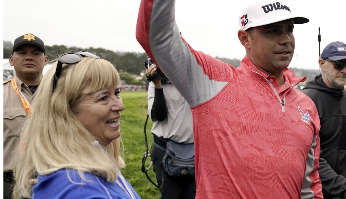 Gary Woodland celebrates with his mother, Linda, after winning the U.S. Open Championship golf tournament Sunday in Pebble Beach, Calif.