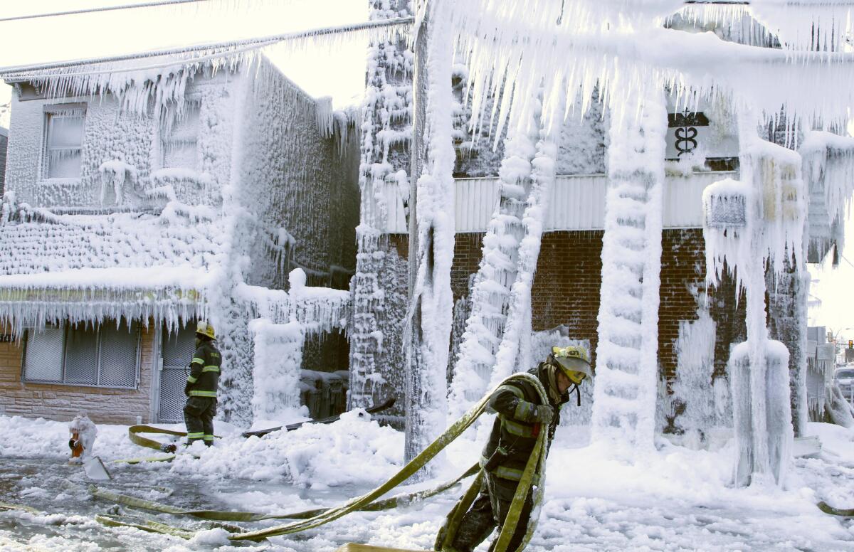 Temperatures in Philadelphia were so low that the water firefighters sprayed on an overnight blaze froze on the buildings.