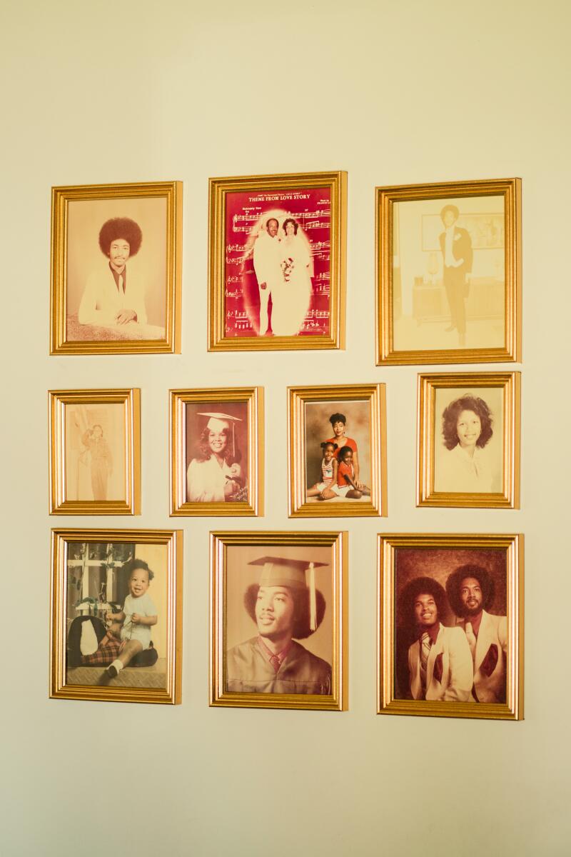 Family photographs displayed on the wall.