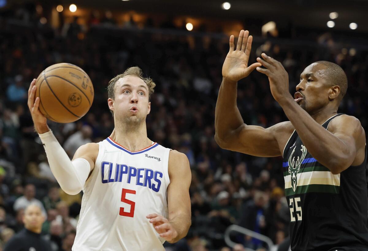Clippers' Luke Kennard drives against the Milwaukee Bucks' Serge Ibaka during the second half Friday.