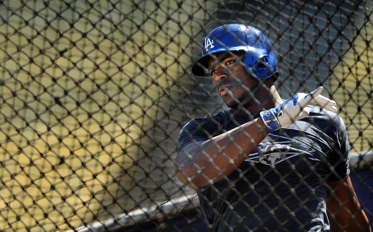 Dodgers outfielder Yasiel Puig takes batting practice at Dodger Stadium during a workout on Oct. 7.