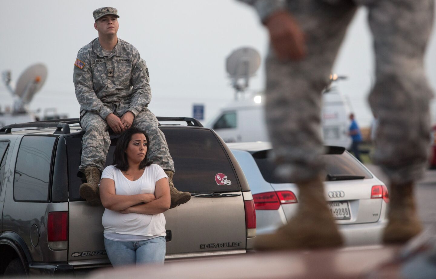 Lucy Hamlin and her husband, Spc. Timothy Hamlin, wait for permission to reenter Ft. Hood, where they live.