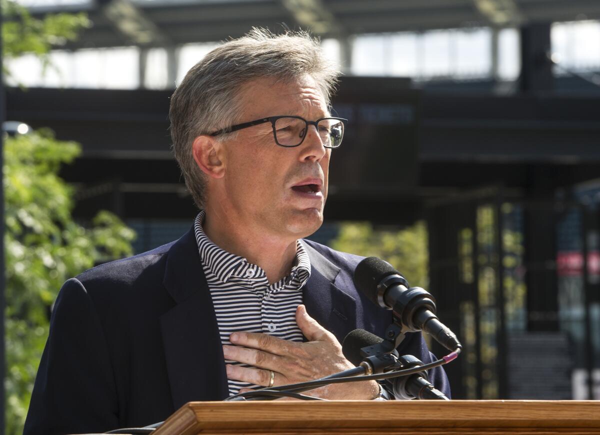 Cleveland Indians owner Paul Dolan speaks during a statue unveiling.