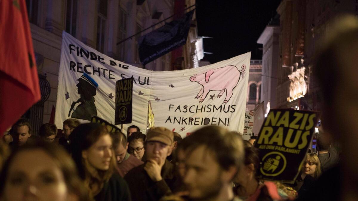 Demonstrators protest against Austria's far-right Freedom Party in Vienna on Sunday.