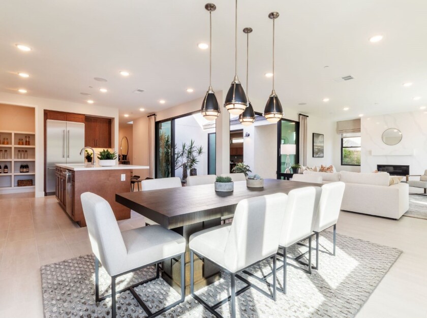 Plan Three’s spacious dining room and open kitchen and living area create a perfect space for entertaining friends or relaxing with family.