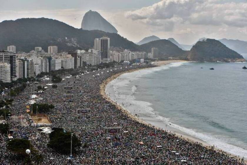 People pack Copacabana beach in Rio de Janeiro as Pope Francis celebrates the final Mass of his visit to Brazil.