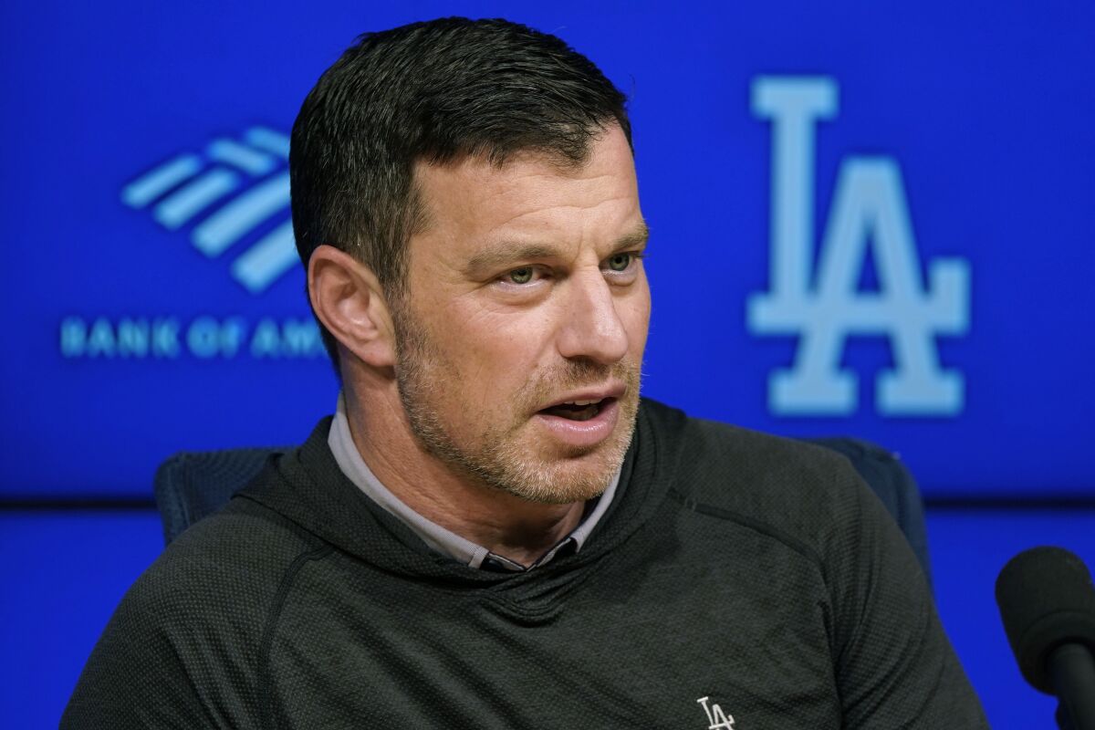 Dodgers president of baseball operations Andrew Friedman fields questions before a team workout during last season's NLDS.
