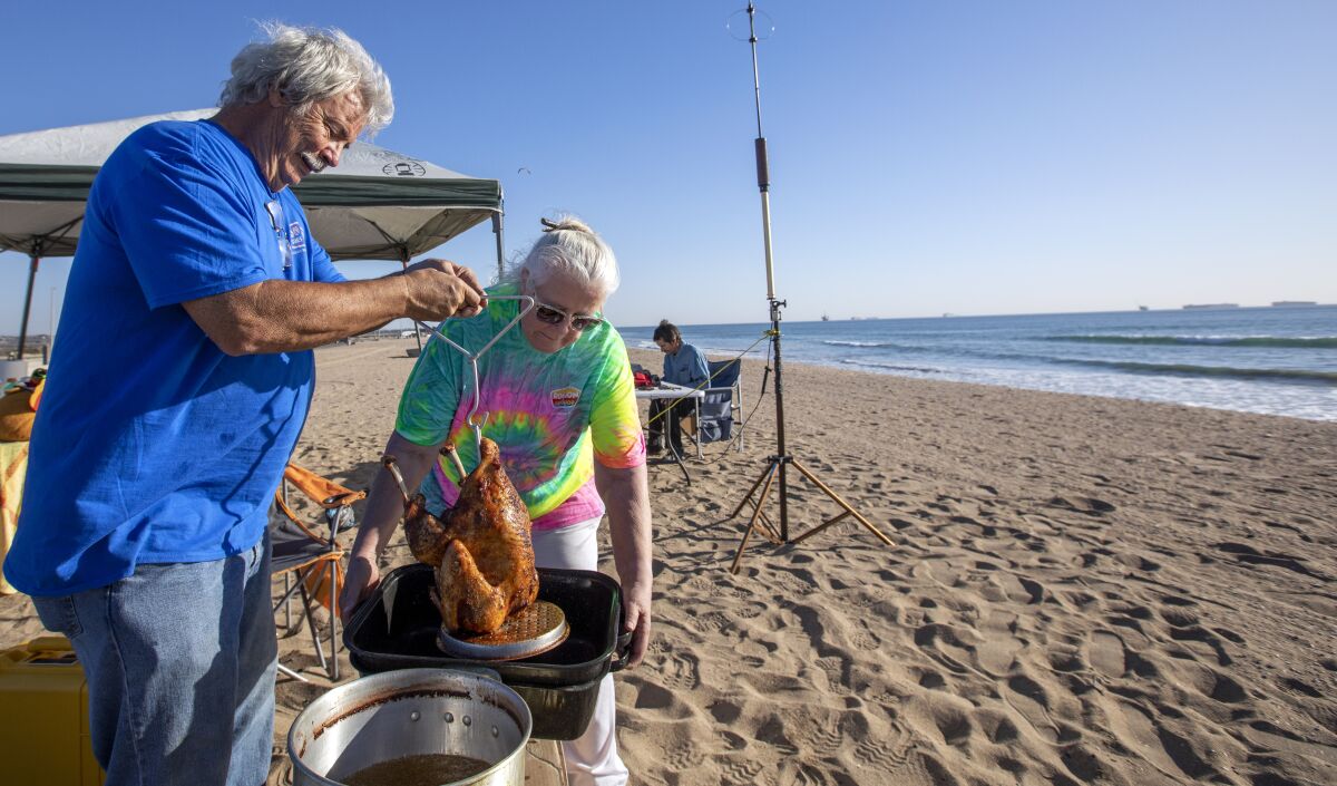 A couple deep-fry a turkey at Bolsa Chica State Beach