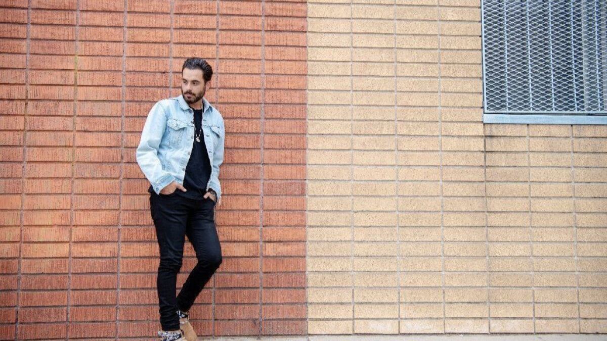 Fashion designer Mike Amiri outside his studio in downtown Los Angeles. He makes jeans that can cost $1,000 or more and T-shirts that can set the wearer back as much as $325.