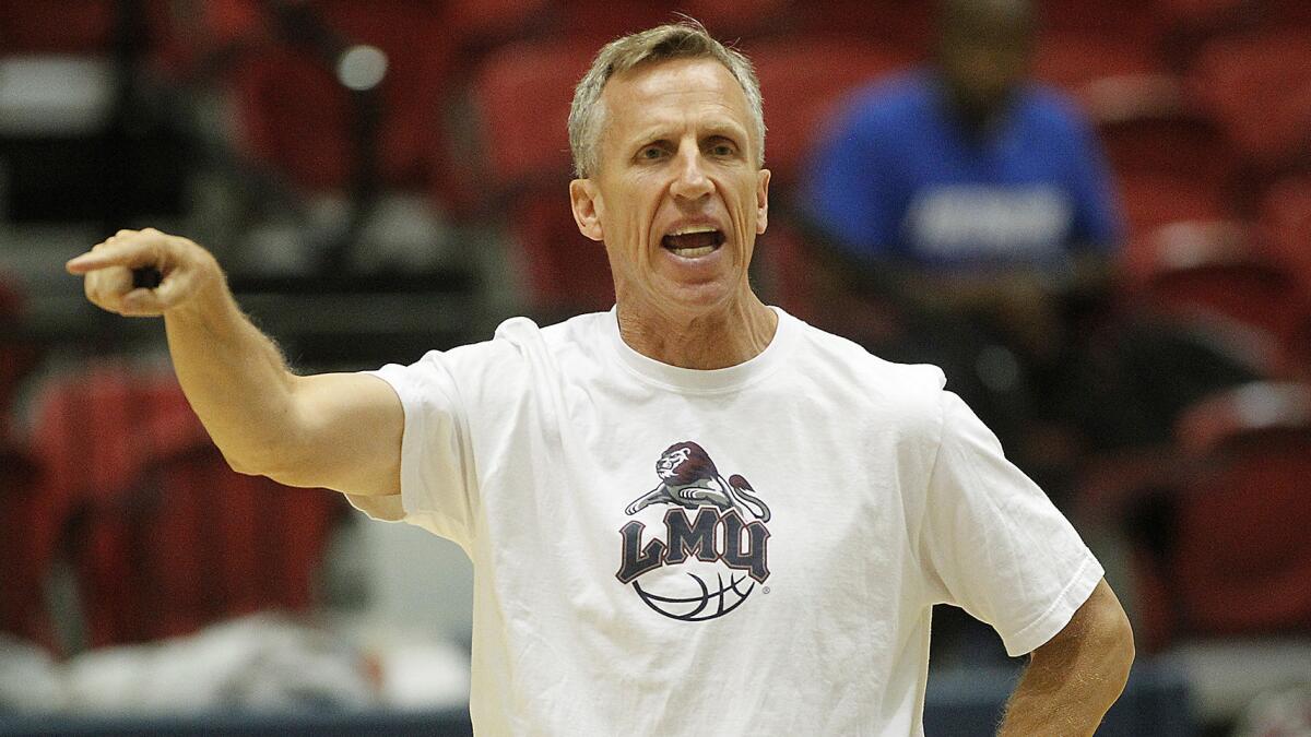 Loyola Marymount men's basketball Coach Mike Dunlap directs his players during a team scrimmage Friday.