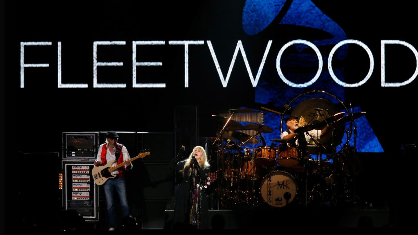 John McVie, left, Stevie Nicks and Mick Fleetwood of Fleetwood Mac perform at Radio City Music Hall in New York on Friday for their MusiCares Person of the Year tribute, the first time a group received the award.