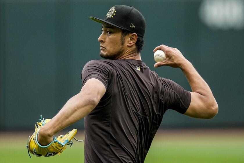 San Diego Padres pitcher Yu Darvish warms up before a baseball game between the Atlanta Braves and the San Diego Padres, Friday, May 17, 2024, in Atlanta. Darvish is slated to pitch Saturday. (AP Photo/Mike Stewart)