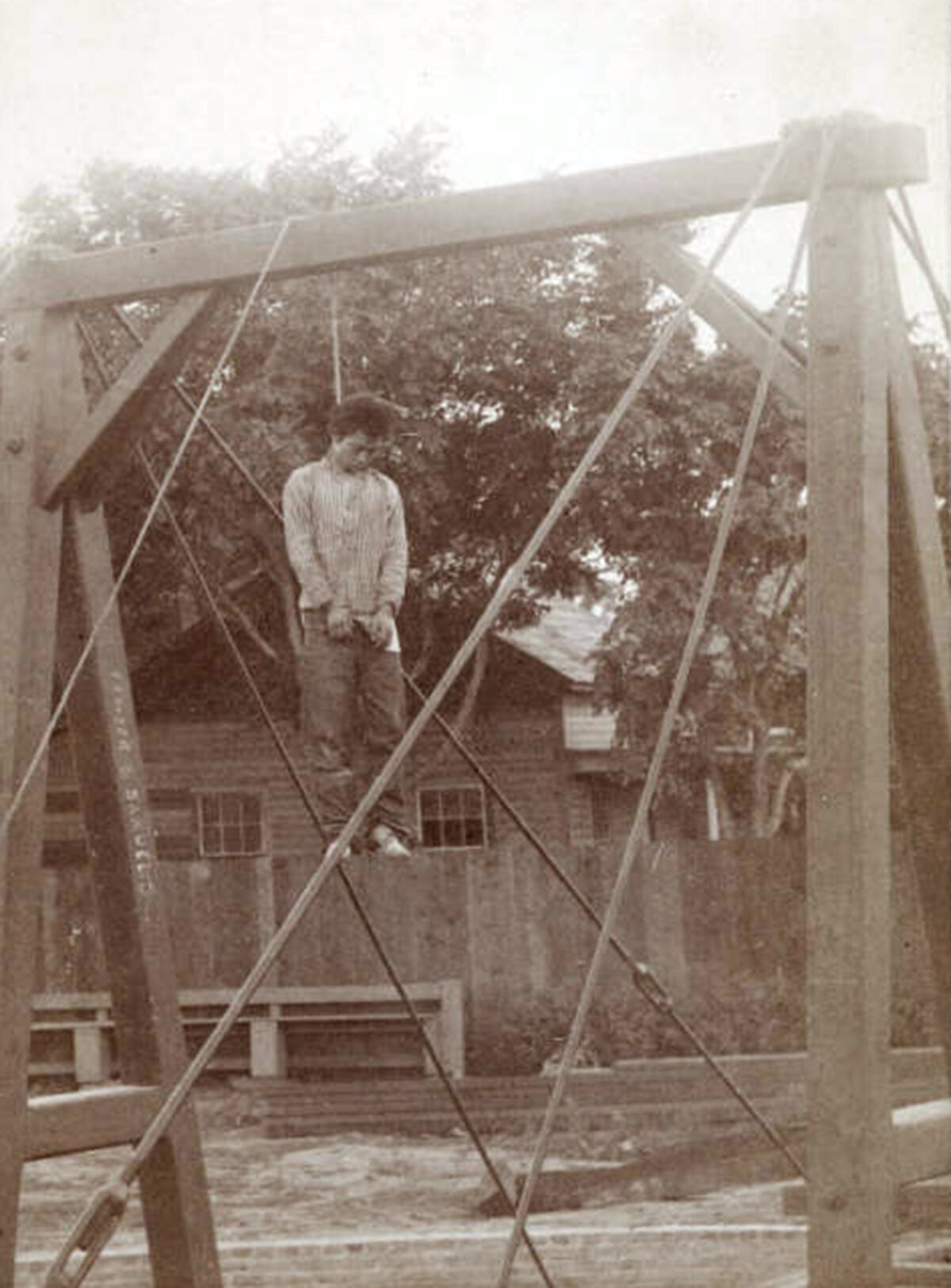 A man is hanged from from a scaffolding 