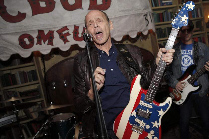 FILE - Wayne Kramer performs at the after party for the CBGB West Coast Premiere Powered by Ciroc at Hemingway's Lounge, Tuesday, Oct. 1, 2013, in Beverly Hills, Calif. Kramer, the co-founder of the protopunk Detroit band the MC5 that thrashed out such hardcore anthems as “Kick Out the Jams” and influenced everyone from the Clash to Rage Against the Machine, died Friday, Feb. 2, 2024. at Cedars-Sinai hospital in Los Angeles, according to Jason Heath, a close friend and executive director of Kramer's charity, Jail Guitar Doors. Heath said the cause of death was pancreatic cancer. He was 75.(Photo by Todd Williamson/Invision for Ciroc/AP, File)