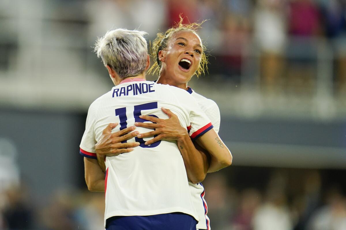 United States' Megan Rapinoe and Mallory Pugh celebrate a goal by Rose Lavelle.