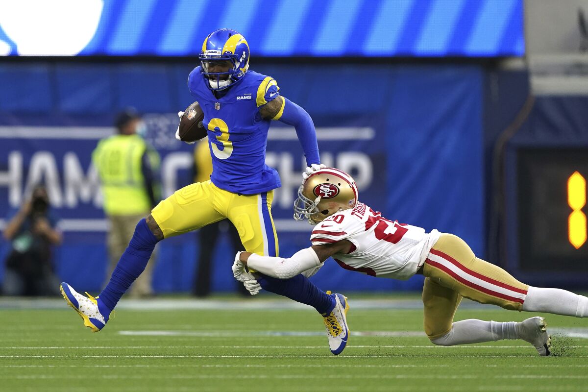 Rams wide receiver Odell Beckham Jr. tries to break a tackle by San Francisco 49ers cornerback Ambry Thomas.