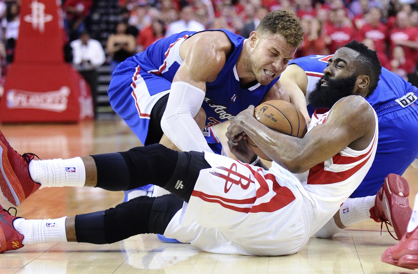 Clippers forward Blake Griffin and Rockets guard James Harden battle for a loose ball in the second half of Game 2.