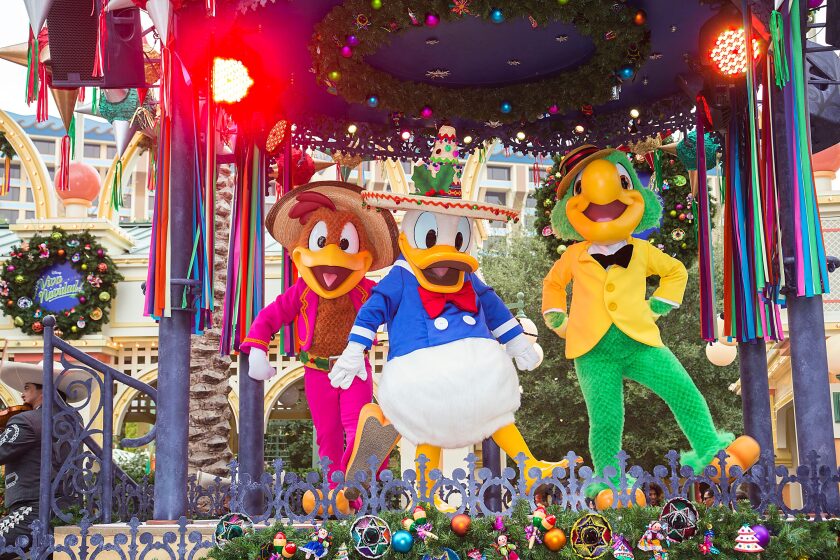 The Three Caballeros anchor Disney's Viva Navidad street parade at California Adventure Park.