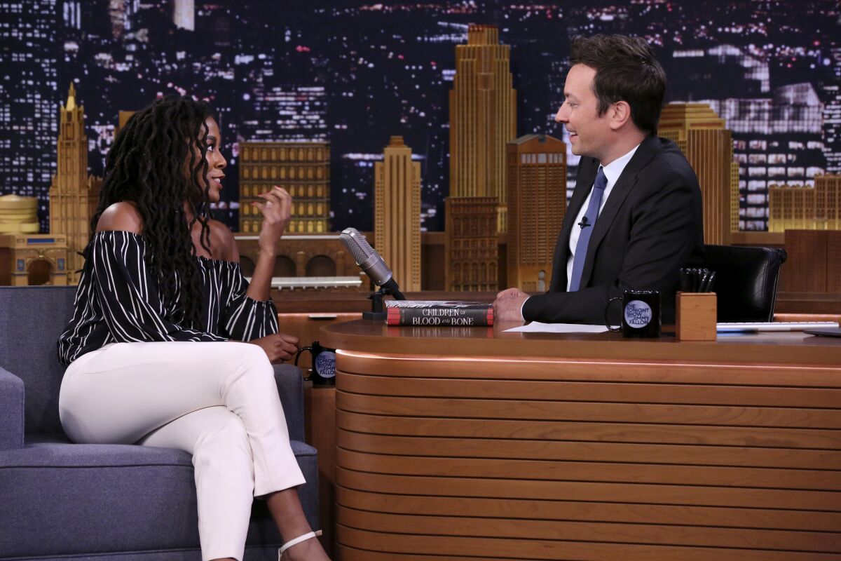 Tomi Adeyemi sits across from Jimmy Fallon as a guest on "The Tonight Show" in 2018.