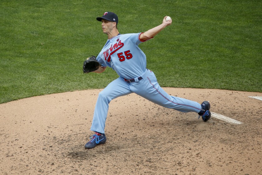 Taylor Rogers, then playing for the Twins, pitches against the Royals in a game in 2020.
