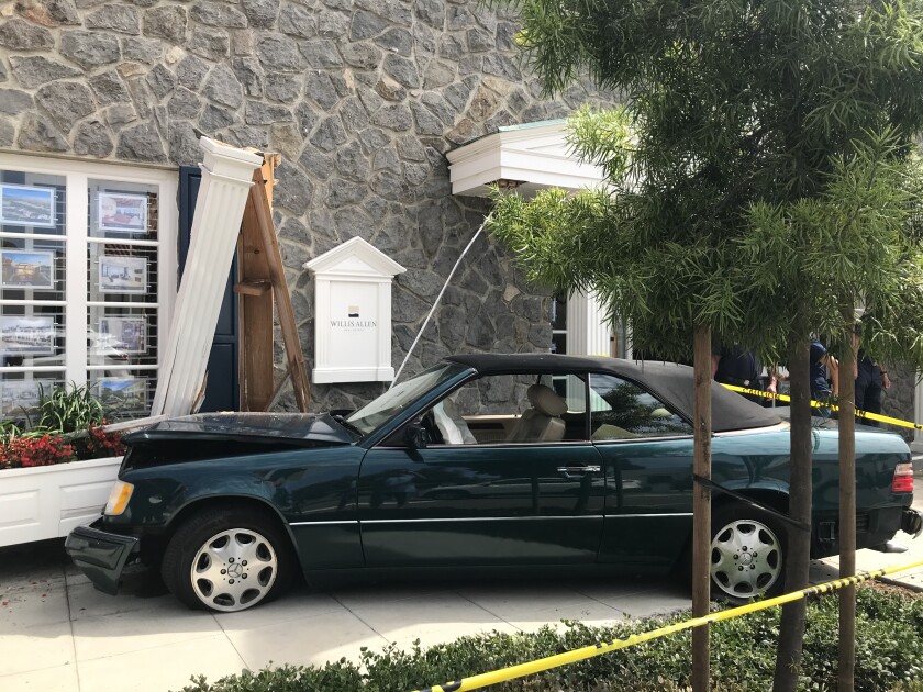 A car crashed into Willis Allen Real Estate Aug. 11. No injuries were reported, according to the property manager.