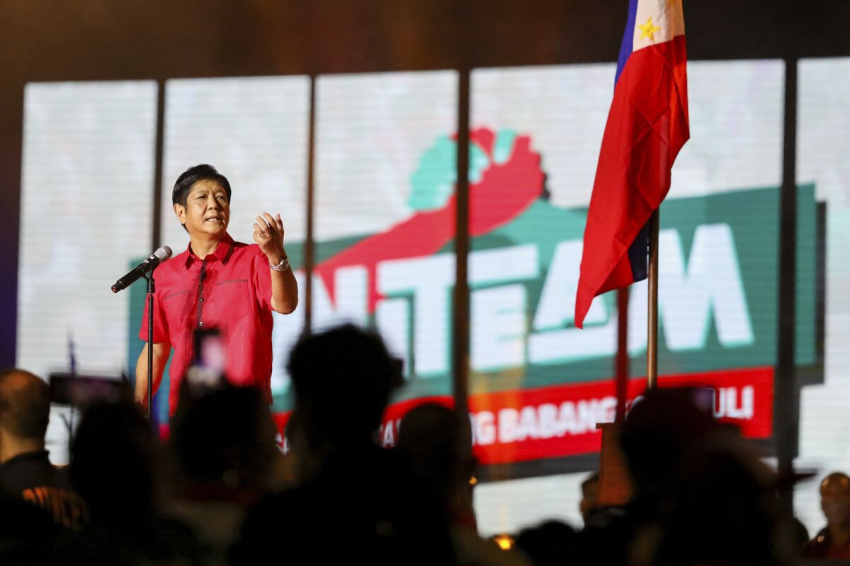 Former senator Ferdinand "Bongbong" Marcos Jr. speaks to supporters during his proclamation rally promoting his presidential bid for the 2022 national elections, at the Philippine Arena, Bulacan province, north of Manila, Philippines, Tuesday, Feb. 8, 2022. Campaigning in the Philippines' presidential election started Tuesday with a cast of candidates led by a late dictator's son and the pro-democracy current vice president, with all vowing to bail out a country driven deeper into poverty by the pandemic and plagued by gaping inequalities and decades-long insurgencies. (AP Photo/Basilio Sepe)