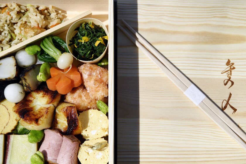 Asian cuisine and chopsticks on a table.