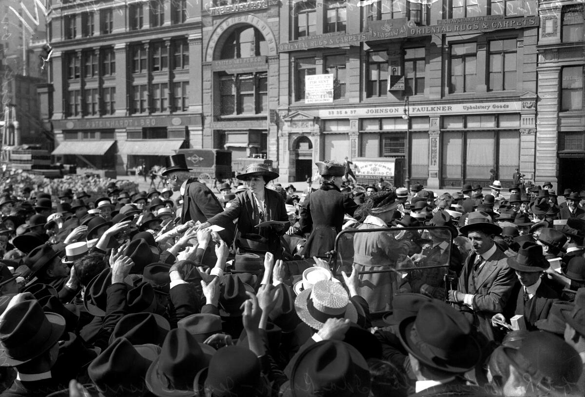 Women hand out pamphlets on birth control in Union Square on May 20, 1916. 