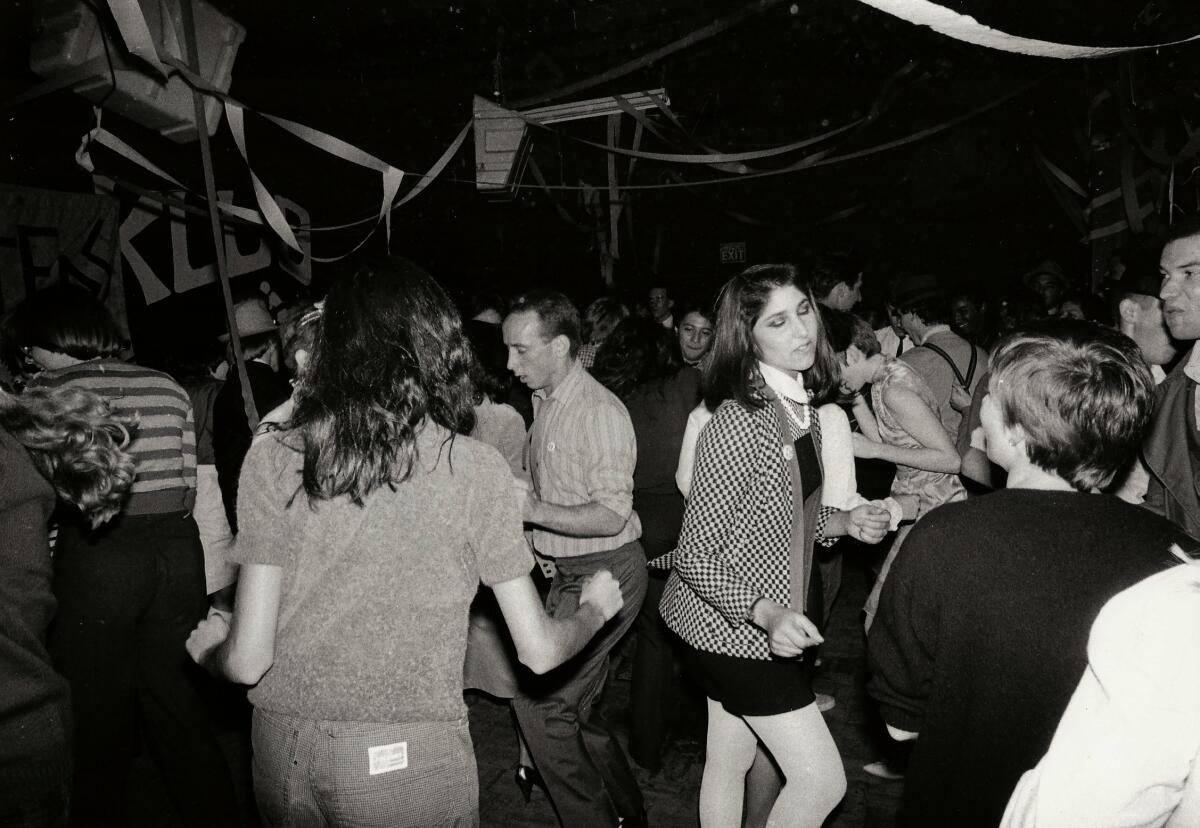 A black-and-white photo of people dancing