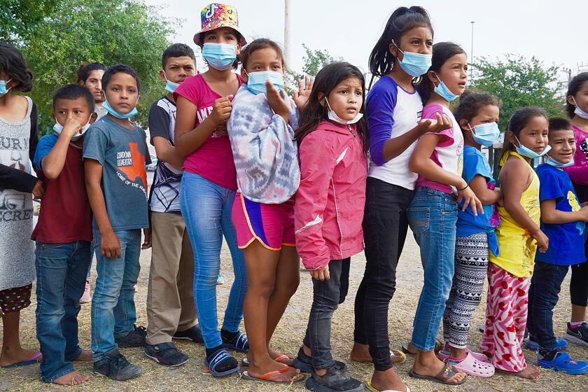 Itzy Varela Cruz, 8,from Honduras (center with pink long sleeve jacket ), lines up with other children for aid. She and her mother were expelled that morning from the U.S. side back to Mexico, along with other families. U.S. Border Patrol has seen large increase in migrant families and children arriving at the Southwest border, especially in South Texas. Migrant children in Plaza de la Republica, Reynosa, line up for food given away by charity group. Most have recently been expelled from the U.S. side by the U.S. Border Patrol.Some Private volunteers provide food and medical care as Mexican authorities offer few resources. Reynosa, Tamaulipas Mexico, across Rio Grande from Texas. Migrant families are deported here each day from the U.S. side. She and others had crossed the Rio Grande on a boat the night before. She arrived at the Plaza de la Republica in Reynosa where hundreds of expelled migrants are squatting. Many fear being kidnapped or robbed in the dangerous border city.