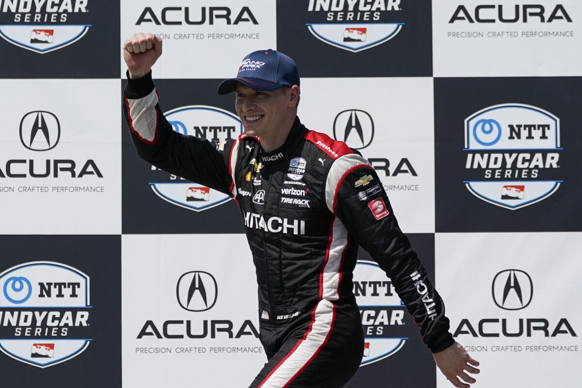 Team Penske driver Josef Newgarden (2) of United States celebrates after winning an IndyCar auto race at the Grand Prix of Long Beach on Sunday, April 10, 2022, in Long Beach, Calif. (AP Photo/Ashley Landis)