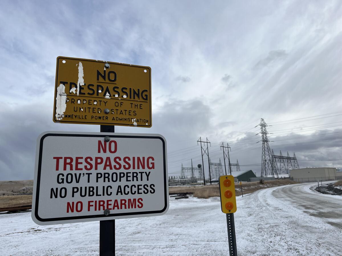 Two "no trespassing" signs at the Garrison Substation west of Helena, Mont.