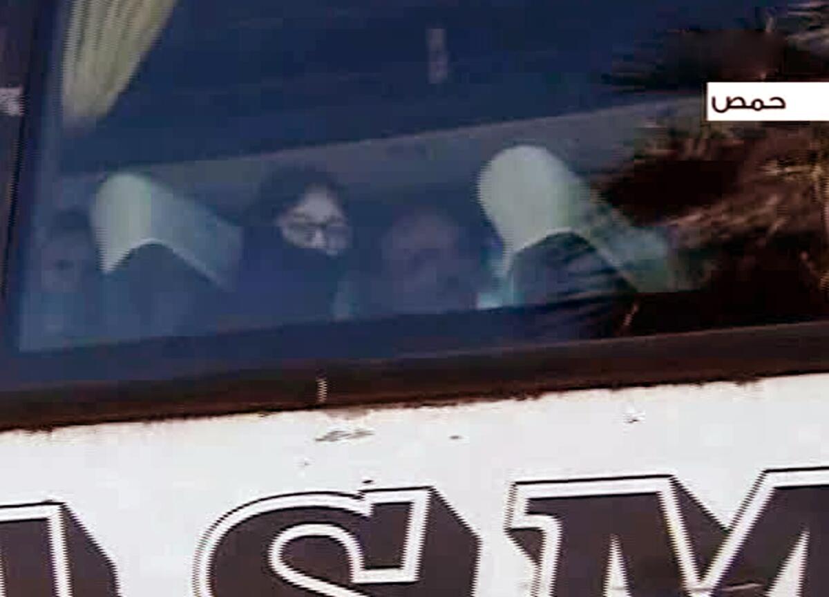 An image from video shows a bus carrying people evacuated Friday from the besieged Old City neighborhood of Homs, Syria.
