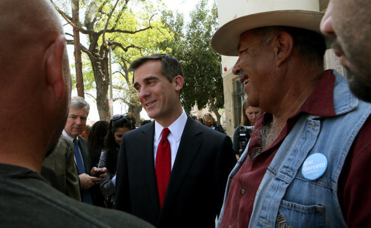 Los Angeles mayoral candidate Eric Garcetti mingles with his supporters.