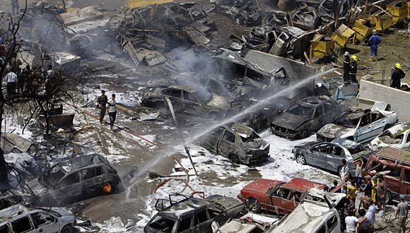 Iraqis gather as firefighters respond to a massive bomb attack near the Foreign Ministry in Baghdad.