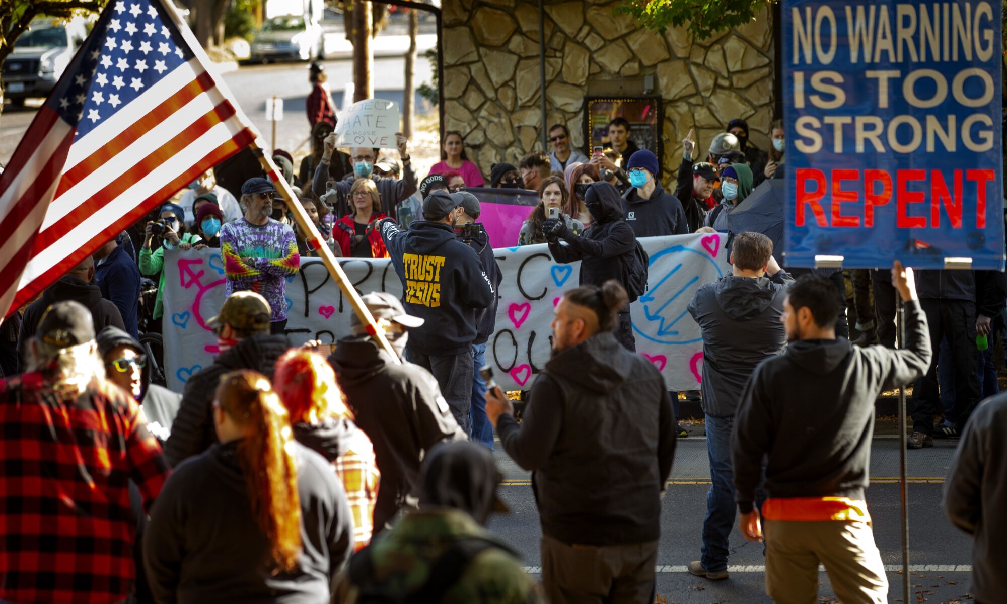 Protesters and supporters square off at the site of a drag story hour event