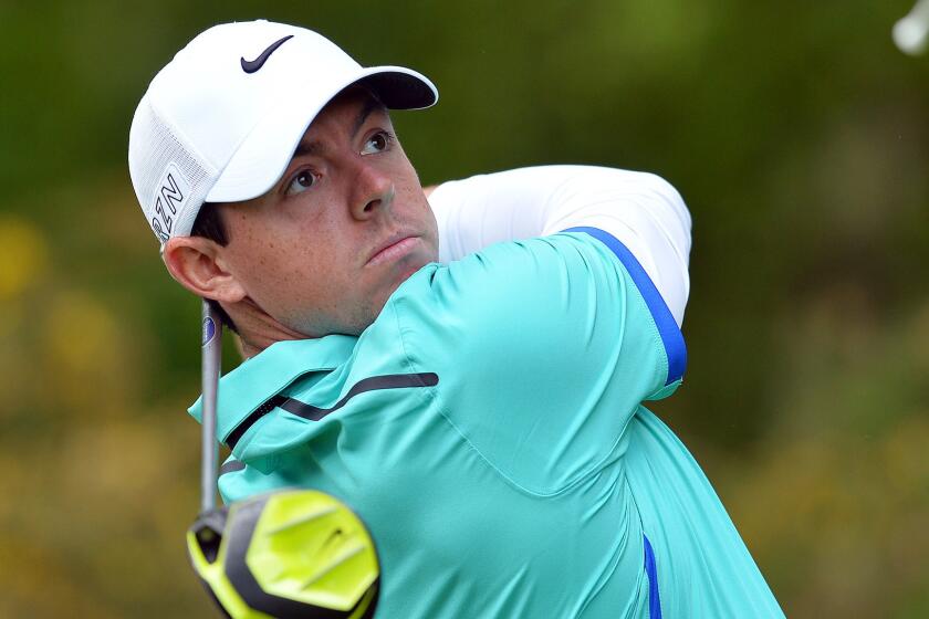 Rory McIlroy hits off the 13th tee during the first round of the BMW PGA Championship at Britain's Wentworth Golf Club on May 21.