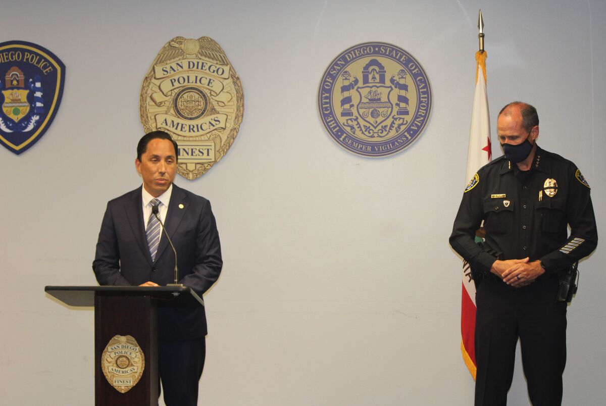 San Diego Mayor Todd Gloria speaks alongside Police Chief David Nisleit at a news conference June 4 at police headquarters. 