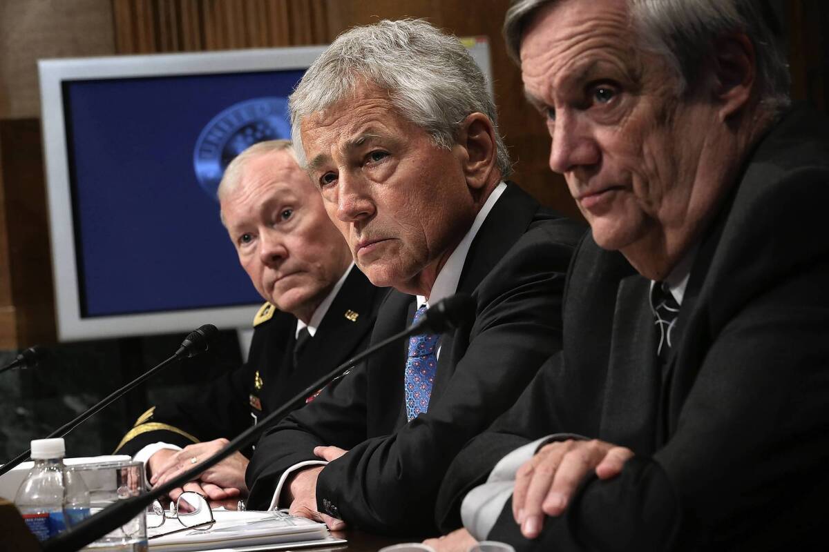 Gen. Martin Dempsey, chairman of the Joint Chiefs of Staff; Defense Secretary Chuck Hagel; and Undersecretary of Defense Robert Hale, from left, testify before the Senate in June.