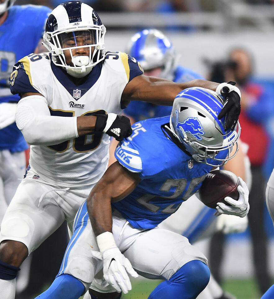 Rams Dante Fowler stops Detroit Lions running back Theo Riddick for a short gain at Ford Field in Detroit on Sunday.