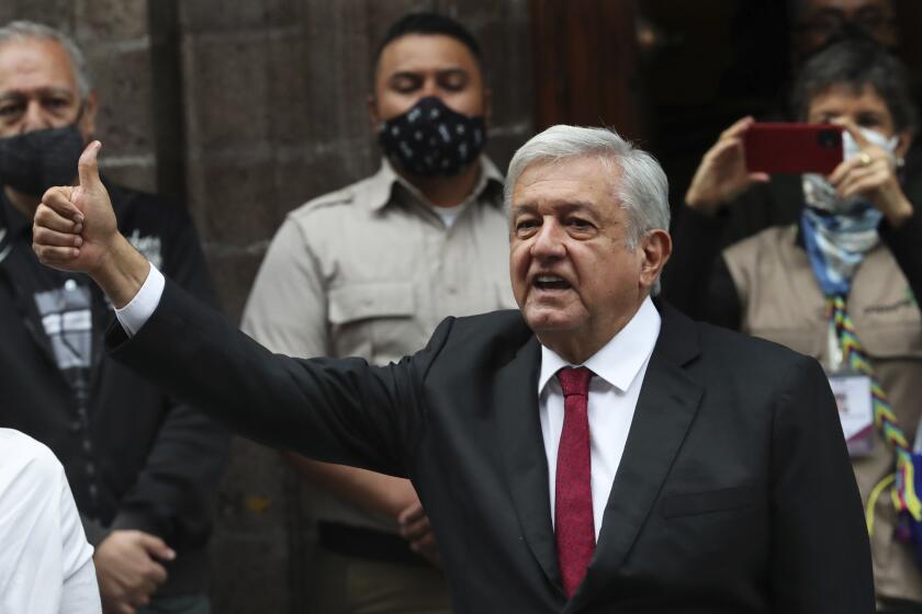 Mexico's President Andres Manuel Lopez Obrador thumbs up after voting in congressional, state and local elections in Mexico City, Sunday, June 6, 2021. Mexicans on Sunday were electing the entire lower house of Congress, almost half the country's governors and most mayors in a vote that will determine if Obrador's Morena party gets the legislative majority. (AP Photo/Marco Ugarte)