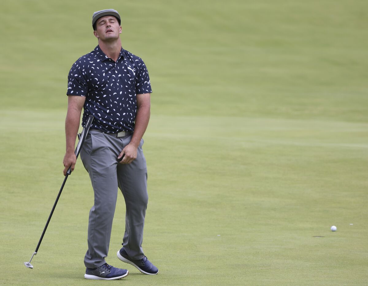 United States' Bryson DeChambeau reacts after missing a putt on the 128th green during the first round British Open Golf Championship at Royal St George's golf course Sandwich, England, Thursday, July 15, 2021. (AP Photo/Ian Walton)