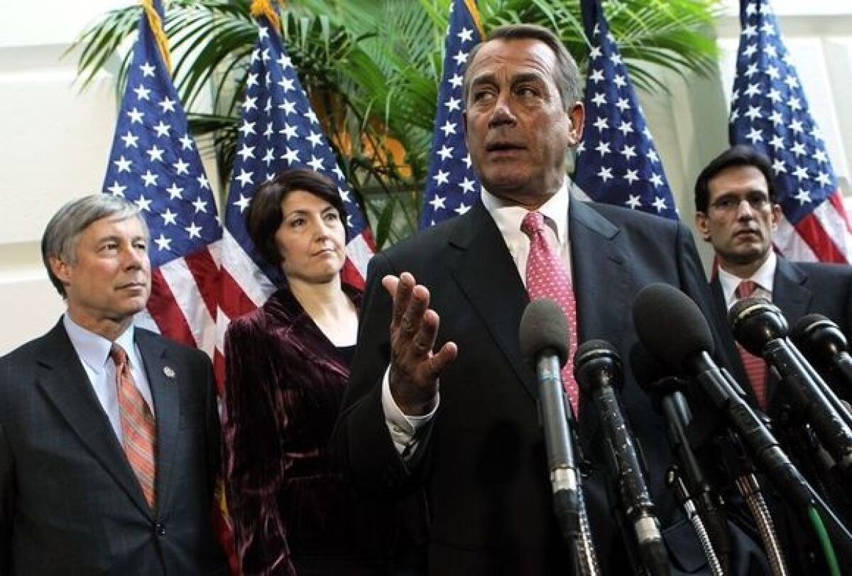 Speaker of the House John A> Boehner speaks with members of the Republican leadership on Capitol Hill.